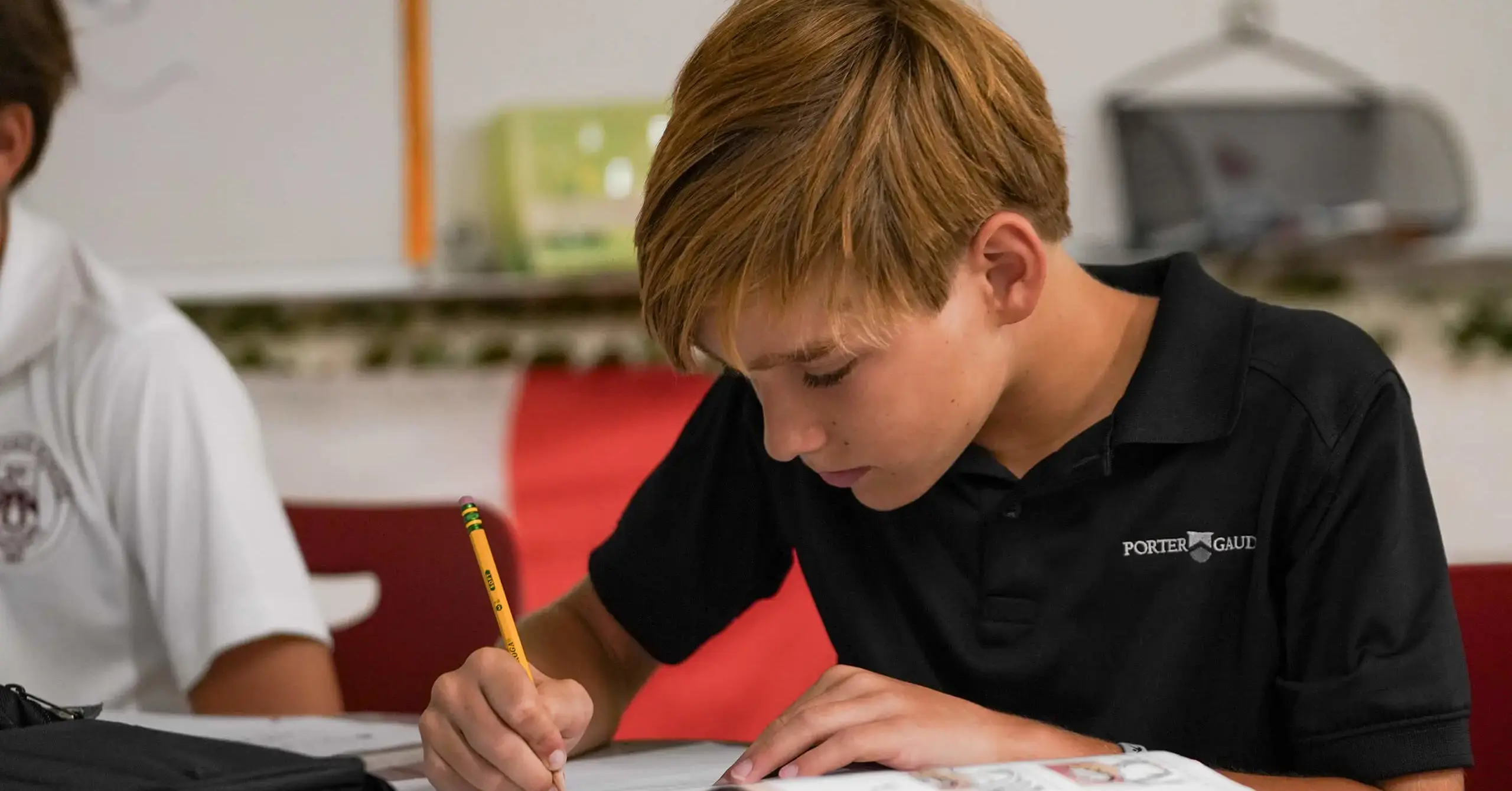 Middle School pupil studying in class at Porter-Gaud