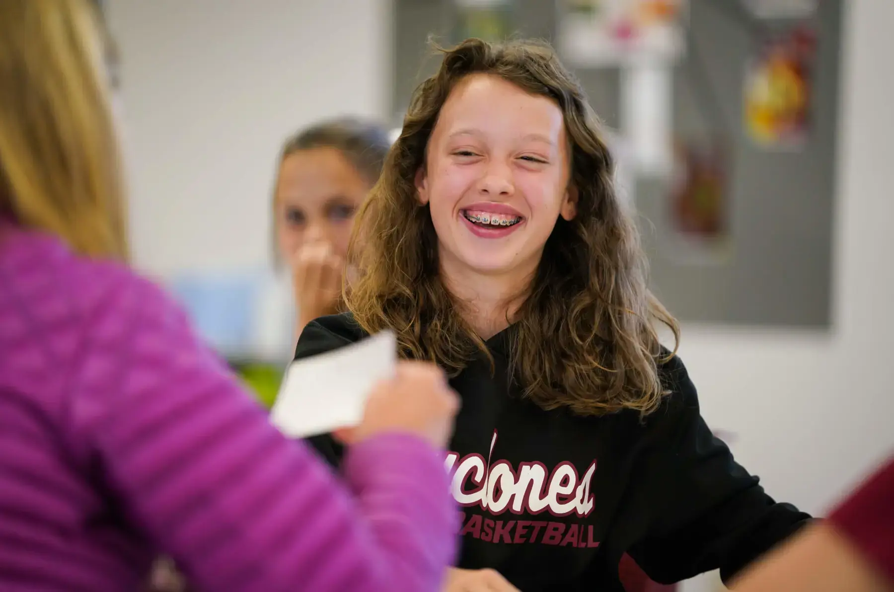 Porter-Gaud Middle School Student smiling in a class