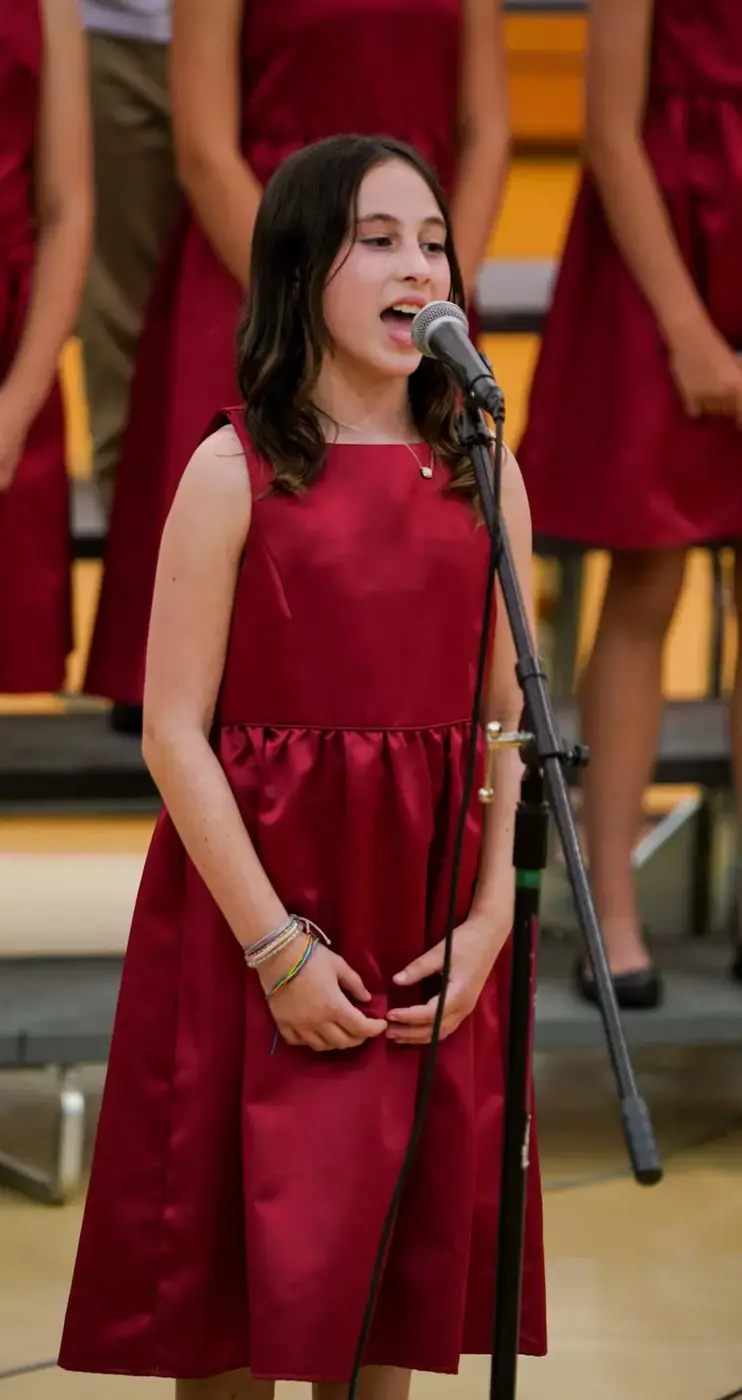 Porter-Gaud student singing with a choir