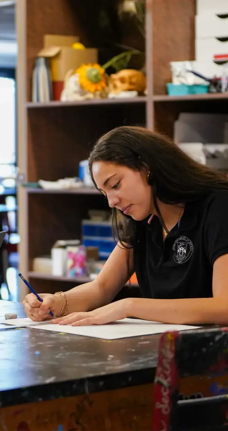 Porter-Gaud student draws in an art class